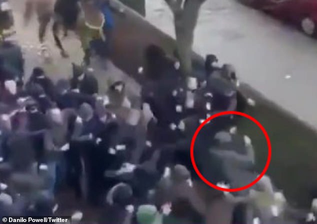 He stumbles as he tries to back away from the attack before eventually falling at the feet of the crowd