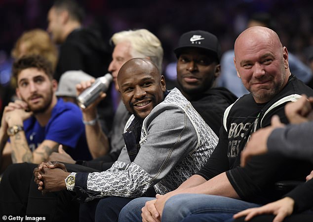 White, pictured here alongside Floyd Mayweather, said he's 'peeked under the hood of boxing'