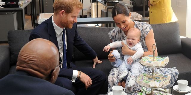 Britain's Duke and Duchess of Sussex, Prince Harry and his wife Meghan Markle hold their baby son Archie as they meet with Archbishop Desmond Tutu at the Tutu Legacy Foundation in Cape Town on Sep. 25, 2019. 