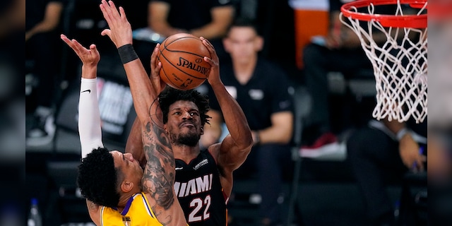 Miami Heat's Jimmy Butler twisted his ankle in the game. (AP Photo/Mark J. Terrill)