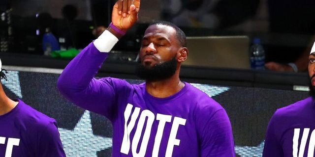 Sep 18, 2020; Lake Buena Vista, Florida, USA; Los Angeles Lakers forward LeBron James (23) gestures at the end of the national anthem before game one of the Western Conference Finals of the 2020 NBA Playoffs against the Denver Nuggets at AdventHealth Arena. (Kim Klement-USA TODAY Sports)