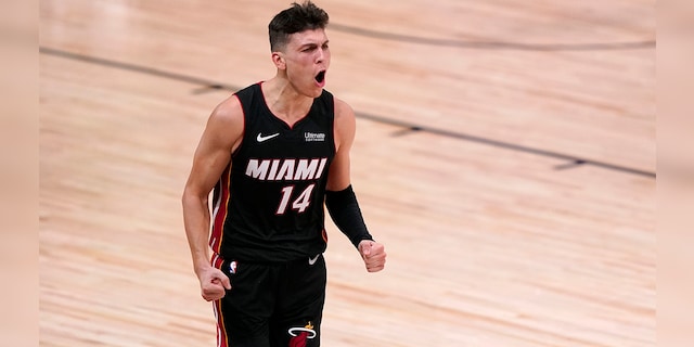 Miami Heat guard Tyler Herro (14) celebrates a basket against the Boston Celtics late in the second half of Game 4 of an NBA basketball Eastern Conference final, Wednesday, Sept. 23, 2020, in Lake Buena Vista, Fla. (AP Photo/Mark J. Terrill)
