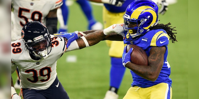 Los Angeles Rams running back Darrell Henderson, right, tries to get around Chicago Bears defensive back Eddie Jackson (39) during the second half of an NFL football game Monday, Oct. 26, 2020, in Inglewood, Calif. (AP Photo/Kelvin Kuo)