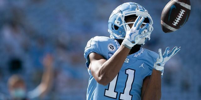 North Carolina's Josh Downs scores on a 17-yard pass from quarterback Sam Howell in the third quarter of an NCAA college football game against North Carolina State, Saturday, Oct. 24, 2020, in Chapel Hill, N.C. (Robert Willett/The News &amp; Observer via AP)