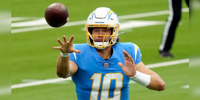 Los Angeles Chargers quarterback Justin Herbert pitches the ball during the first half of an NFL football game against the Jacksonville Jaguars Sunday, Oct. 25, 2020, in Inglewood, Calif. (AP Photo/Alex Gallardo)