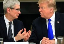 File photo: President Donald Trump talks to Apple Inc. CEO Tim Cook during the American Workforce Policy Advisory Board