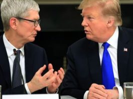 File photo: President Donald Trump talks to Apple Inc. CEO Tim Cook during the American Workforce Policy Advisory Board