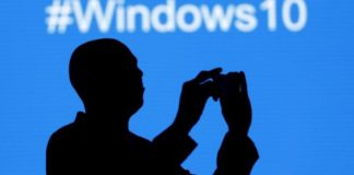 File photo - A Microsoft delegate takes a picture during the launch of the Windows 10 operating system in Kenya