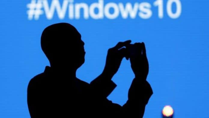 File photo - A Microsoft delegate takes a picture during the launch of the Windows 10 operating system in Kenya