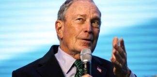 Democratic Presidential candidate and former New York City Mayor Michael Bloomberg gestures while taking part in an on-stage conversation with former California Gov. Jerry Brown at the American Geophysical Union fall meeting.