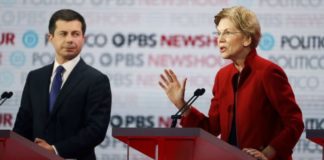 Democratic presidential candidate Sen. Elizabeth Warren, D-Mass., right, speaks as South Bend Mayor Pete Buttigieg listens during a Democratic presidential primary debate Thursday, Dec. 19, 2019, in Los Angeles. (AP Photo/Chris Carlson)
