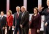 Democratic presidential candidates from left, entrepreneur Andrew Yang, South Bend Mayor Pete Buttigieg, Sen. Elizabeth Warren, D-Mass., former Vice President Joe Biden, Sen. Bernie Sanders, I-Vt., Sen. Amy Klobuchar, D-Minn., and businessman Tom Steyer stand on stage before a Democratic presidential primary debate Thursday, Dec. 19, 2019, in Los Angeles, Calif. (AP Photo/Chris Carlson)