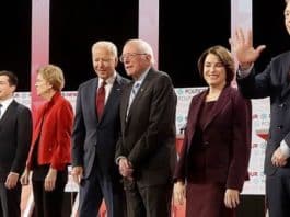 Democratic presidential candidates from left, entrepreneur Andrew Yang, South Bend Mayor Pete Buttigieg, Sen. Elizabeth Warren, D-Mass., former Vice President Joe Biden, Sen. Bernie Sanders, I-Vt., Sen. Amy Klobuchar, D-Minn., and businessman Tom Steyer stand on stage before a Democratic presidential primary debate Thursday, Dec. 19, 2019, in Los Angeles, Calif. (AP Photo/Chris Carlson)